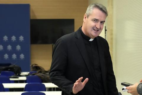 Fr. Andrew Small, a British-born Oblate of the Mary Immaculate priest, CEO of Missio Corp. speaks during a press conference at The Vatican, Saturday, March 25, 2023. (AP Photo/Alessandra Tarantino, File)