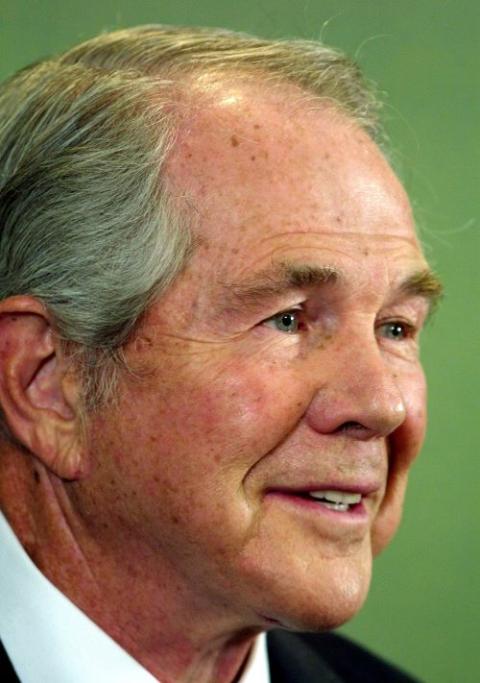 Evangelist Pat Robertson speaks during a news conference in Beijing in this Nov. 28, 2001, file photo. He died June 8 at age 83. (CNS/Reuters)
