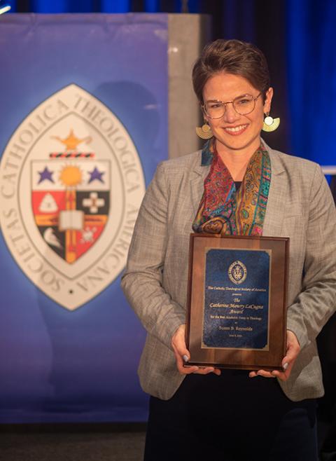 Susan Bigelow Reynolds is pictured with the Catherine Mowry LaCugna Award for best theological essay by a new scholar. (Paul Schutz/Catholic Theological Society of America)