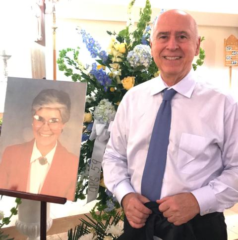 Mike Leach with a photo of his wife Vickie at the Nov. 5, 2022, memorial service at Our Lady Star of the Sea Church in Stamford, Connecticut. (Courtesy of Mike Leach)
