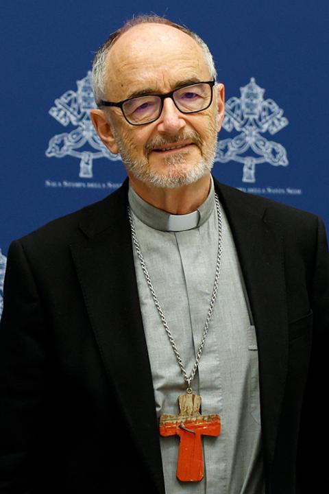Cardinal Michael Czerny wears a pectoral cross created from the remains of a boat used by migrants attempting to reach Lampedusa. (CNS/Lola Gomez)