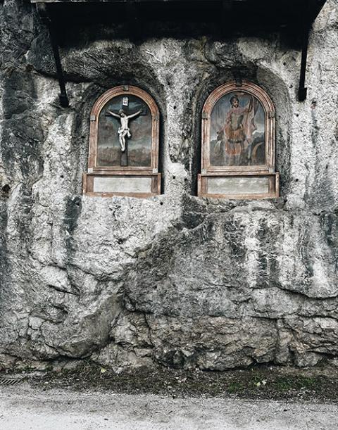 Art hewn into rock seen along the narrow lane leading up from Old Town Salzburg toward the hilltop abbey (Sarah Southern)