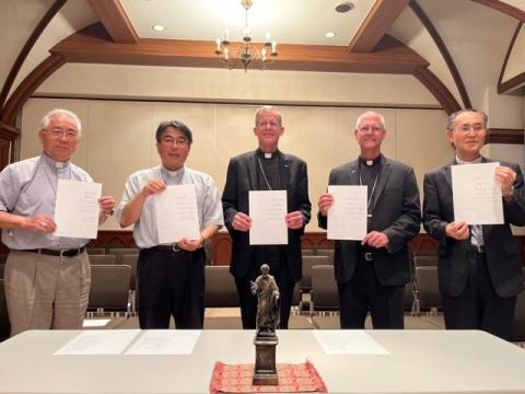 The signatories of an Aug. 9, 2023, declaration to work together toward abolition of nuclear weapons are, from left, retired Archbishop Joseph Mitsuaki Takami of Nagasaki, Japan; Archbishop Peter Michiaki Nakamuru of Nagasaki; Archbishop John Wester of Santa Fe, New Mexico; Archbishop Paul Etienne of Seattle; and Bishop Alexis Mitsuru Shirahama of Hiroshima, Japan. The pledge was signed in Nagasaki on the 78th anniversary of the Aug. 9, 1945, atomic bombing of the city. (OSV News photo/courtesy Archdiocese 