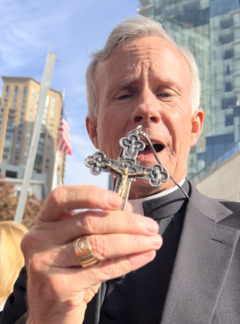 Bishop Joseph Strickland shows his pectoral cross on Nov. 14.