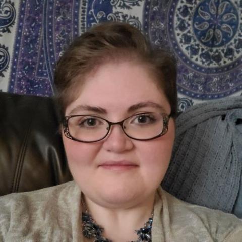 Headshot of a woman wearing glasses