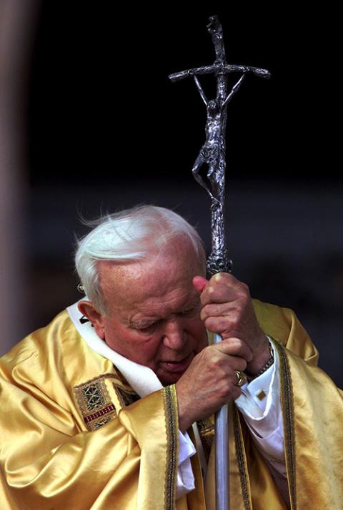 Pope John Paul II bows his head during Mass celebrated after he closed the Holy Door of St. Peter's Basilica at the Vatican on Jan. 6, 2001. (CNS/Reuters)