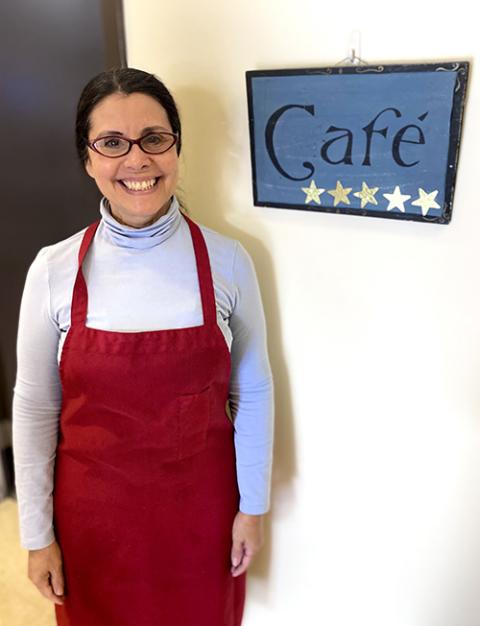 Jackie Torres near the entrance to the kitchen at Holy Family Service Center (Tom Hoffarth)