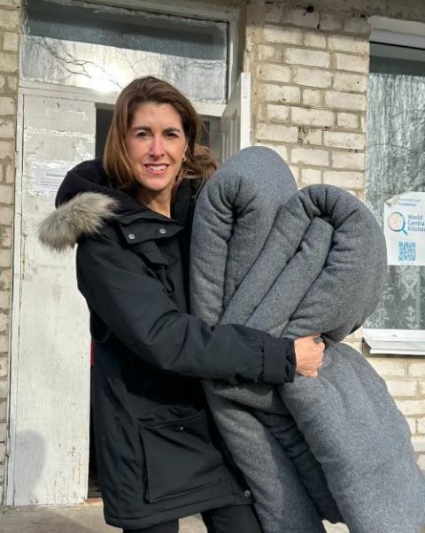 Kerri Murray, president of ShelterBox USA, delivers blankets to people in Ukraine in February 2023. 