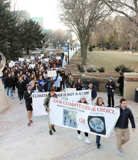 People rally at Creighton University in Omaha, Nebraska, Feb. 20, 2020, calling for the Jesuit-run school to fully divest from fossil fuels. (CNS/Courtesy of Emily Burke)