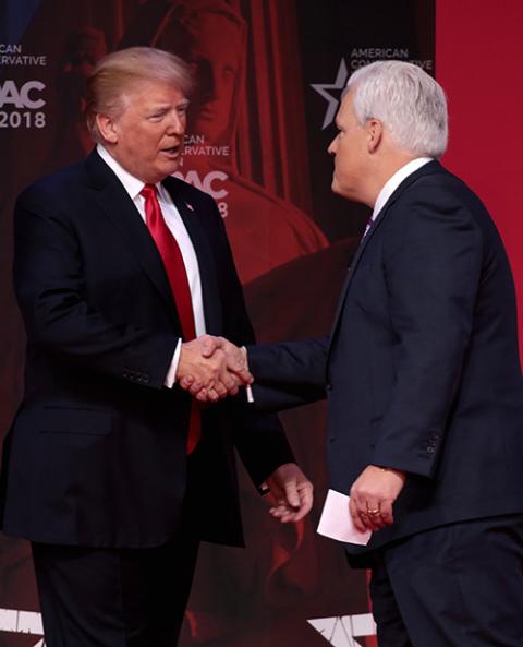 President Donald Trump greets Matt Schlapp at the Conservative Political Action Conference (CPAC) in National Harbor, Maryland, Feb. 23, 2018. (Wikimedia Commons/Gage Skidmore)