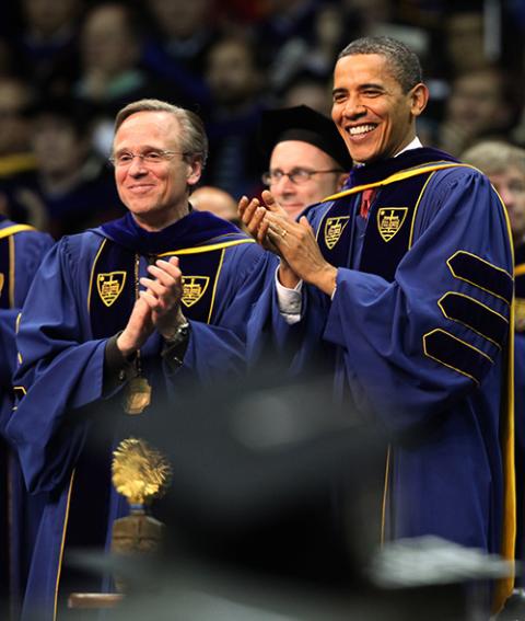Holy Cross Fr. John Jenkins and U.S. President Barack Obama applaud during the commencement ceremony at the University of Notre Dame in Notre Dame, Indiana, May 17, 2009. Obama was the commencement speaker and honorary degree recipient. (CNS/Christopher Smith)