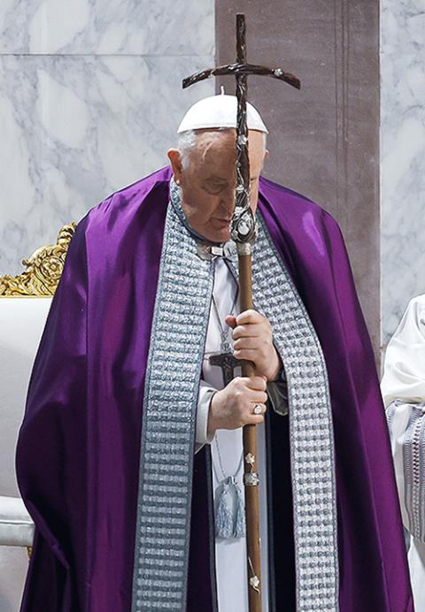 Pope Francis holds his crosier as the Gospel is read during his Ash Wednesday Mass at the Basilica of Santa Sabina in Rome Feb. 14. (CNS/Lola Gomez)