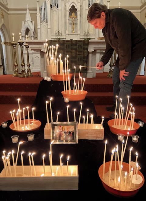 The altar at The Catholic Shrine of the Immaculate Conception prepared for an impromptu memorial on Feb. 5, the night of Msgr. Henry Gracz's death. Fr. Joseph Morris, the shrine's parochial vicar, is pictured. (Courtesy of the Shrine of the Immaculate Conception)