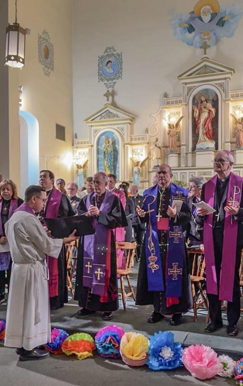 At Sacred Heart Parish in El Paso, Texas, March 21, Bishop Mark Seitz (third from right) speaks during an interfaith vigil to pray for the dignity of migrants. (OSV News screenshot/Live broadcast via Facebook)