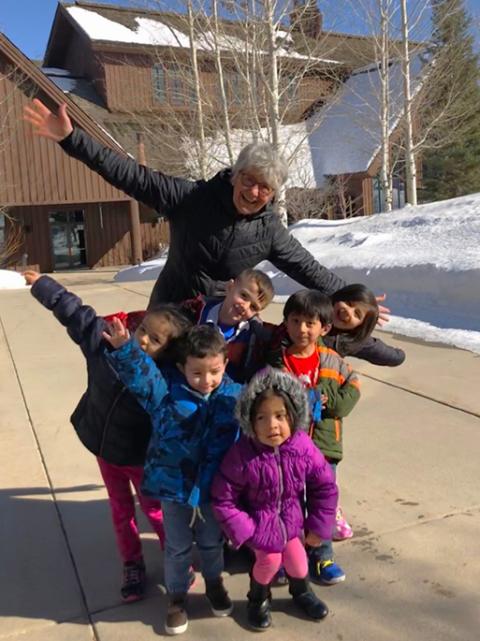 Sr. Mary Ann Pajakowski enjoys a silly moment with preschool children at the School Readiness Program operated by Holy Cross Ministries in Park City, Utah. (Courtesy of Miriam Garcia/Holy Cross Ministries)