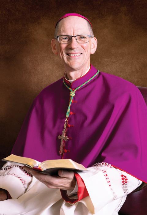 Bishop John J. McDermott of Burlington, Vermont. Formal portrait of the bishop in choir dress smiling.