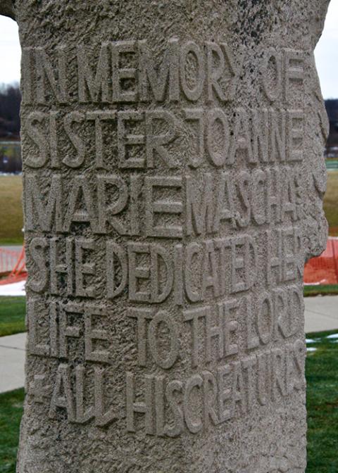 The inscription on the back of the statue donated to the Cleveland Ursulines by the family of Sr. Joanne Marie Mascha after her murder says she dedicated her life to God and his creatures. (GSR photo/Dan Stockman)