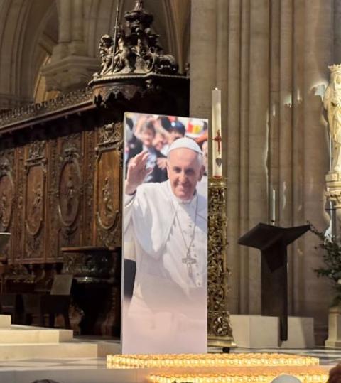 A large photograph of Pope Francis stands beside the lectern at Notre-Dame de Paris during Mass April 23. A large photograph of Pope Francis stands beside the lectern at Notre-Dame de Paris during Mass April 23.