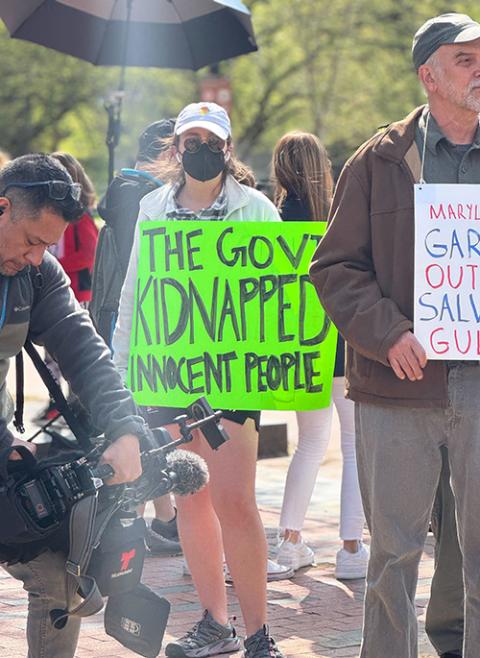 A woman holds a sign near others gathered for a Holy Week vigil April 14 near the White House, praying for the freedom of Kilmar Abrego Garcia, a Salvadoran deported in March. Abrego, along with other immigrants, was sent to a Salvadoran prison after being deported, even though he has no criminal record. (GSR photo/Rhina Guidos)  