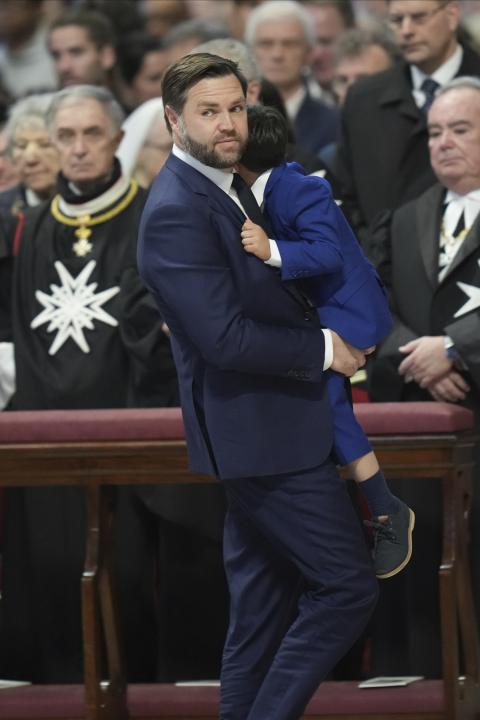 Vance at Vatican U.S. Vice President JD Vance, center, with daughter Mirabel, back to camera, and wife Usha with son Vivek, left, attends a Good Friday service inside St. Peter's Basilica at the Vatican, April 18, 2025. (AP Photo/Alessandra Tarantino)