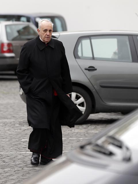 Cardinal Jorge Mario Bergoglio arrives for a meeting at the Vatican on March 6, 2013. Cardinals from around the world were gathering inside the Vatican for their first round of meetings before the conclave to elect the next pope, amid scandals inside and out of the Vatican and the continued reverberations of Pope Benedict XVI's decision to retire. (AP/Alessandra Tarantino)