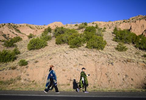 pilgrims in New Mexico Dianne DeLeon, left, and her mother Victoria Trujillo walk along Juan De Medina Rd on their way to the El Santuario De Chimayo in Northern New Mexico on Good Friday, April 18, 2025. Chimayo, N.M. (AP Photo/Roberto E. Rosales)