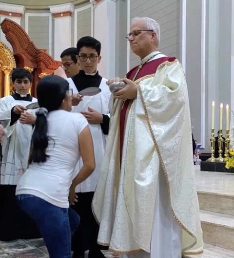 Then-Bishop Robert Prevost distributes Communion during Mass in Chiclayo, Peru, in this screengrab from a video obtained on social media and released on April 11, 2023. (OSV News/Lambayeque Regional Governor Jorge Perez Flores via Reuters)