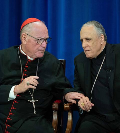 Cardinal Timothy Dolan of New York and Cardinal Daniel DiNardo, the retired archbishop of Galveston-Houston, talk during a news conference at the Pontifical North American College May 9, 2025. (CNS/Kendall McLaren)
