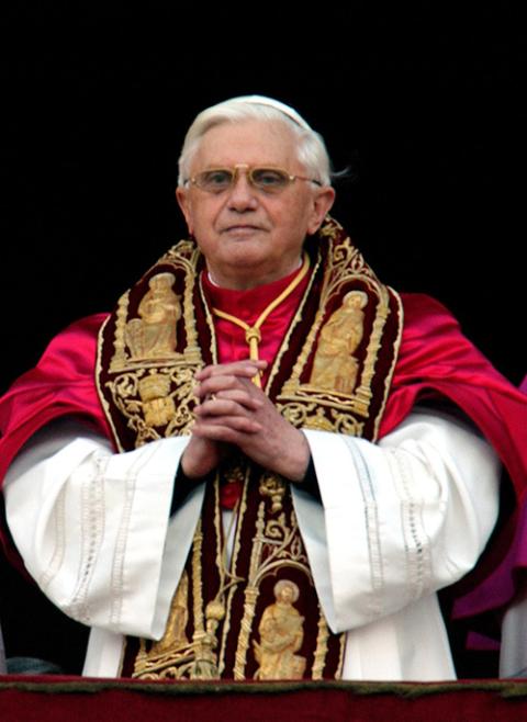 With folded hands, Pope Benedict XVI stands on the central balcony of St. Peter's Basilica April 19, 2005, before a crowd of nearly 100,000 people. (CNS/Catholic Press Photo/Alessia Giuliani)
