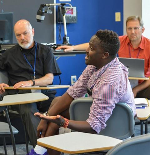 A participant discusses his views at a small group session during the "Laudato Si' and the U.S. Catholic Church" gathering at Creighton University in Omaha, Neb., June 27-29, 2019. (CNS/Catholic Climate Covenant)