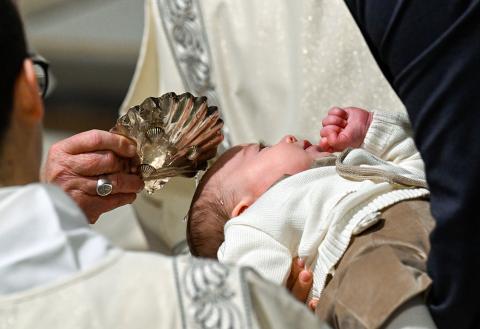 Pope Francis baptizes a baby during Mass in the Sistine Chapel at the Vatican Jan. 12, 2025, the feast of the Baptism of the Lord. (CNS/Vatican Media)