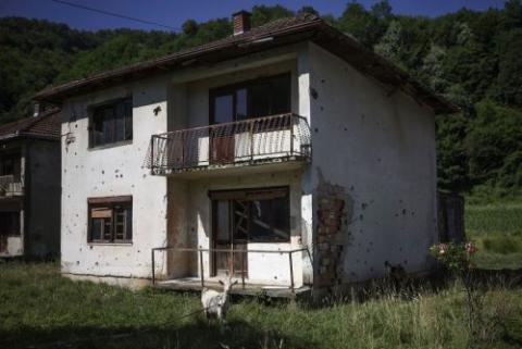 Goats are seen outside one of the destroyed houses in Potocari, Bosnia. Goats are seen outside one of the destroyed houses in Potocari, Bosnia.