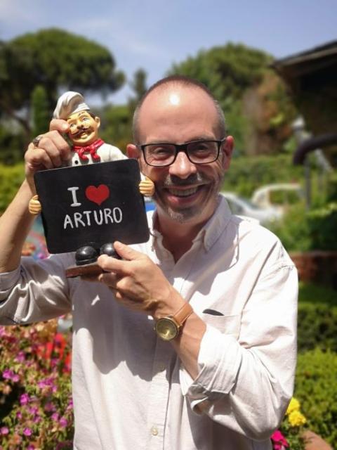 John L. Allen Jr. stands outside Ristorante Arturo in Rome in this undated photo. (Courtesy of Christopher White)