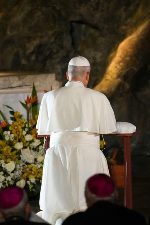 Pope Leo XIV prays before the statue of Our Lady of Lourdes at the Grotto of the Apparitions at Massabielle at the Shrine of Our Lady of Lourdes in Lourdes, France, Sept. 26, 2026. (CNS/Lola Gomez)