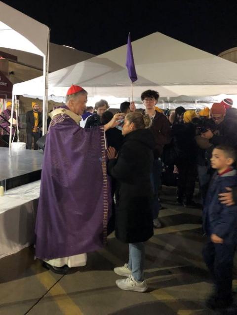 Chicago Cardinal Blase Cupich distributes ashes to the faithful at Ash Wednesday Mass for Chicago-area migrants in Melrose Park, Ill., Feb. 18, 2026. (OSV News/Simone Orendain)