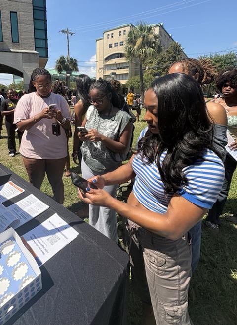 Sr. Carol Coston fellow Erica Walden registers her peers to vote at Xavier University of Louisiana in New Orleans, September 2026. (Courtesy of Erica Walden)