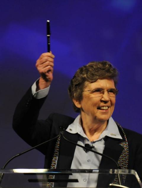 Sr. Carol Keehan, then president and CEO of the Catholic Health Association, holds up a pen at the 2010 CHA convention in Denver. The ceremonial pen was one of 20 used by U.S. President Barack Obama to sign the Affordable Care Act into law. 