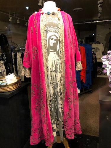 A Virgin Mary inspired dress stands on display in the front window of a shop in Rehoboth, Delaware in March 2021. RNS photo
