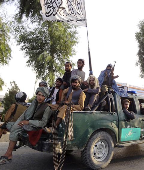 Taliban fighters patrol inside the city of Kandahar, southwest Afghanistan, Aug. 15. (AP/Sidiqullah Khan) Taliban fighters patrol inside the city of Kandahar, southwest Afghanistan, Aug. 15. (AP/Sidiqullah Khan)