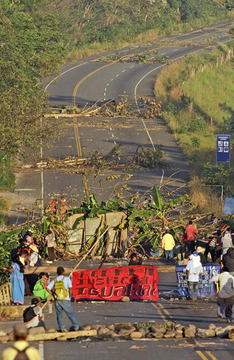 Ngäbe-Buglé people block the Pan-American Highway in El Vigui, Panama, on Feb. 4, 2012, to protest mining exploitation on their lands. (AP Photo/Arnulfo Franco)