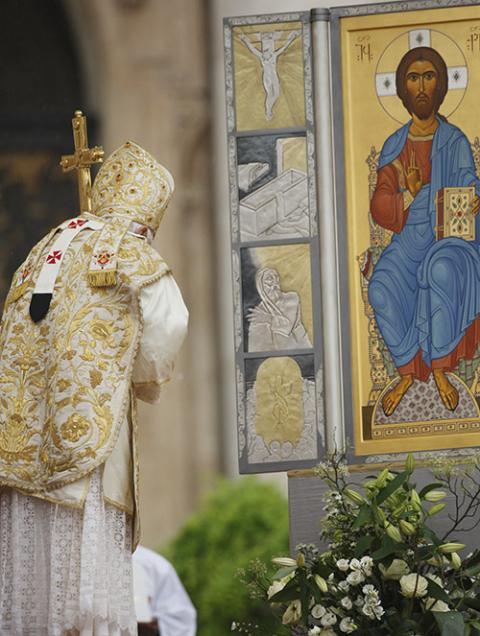 Pope Benedict XVI reverences an image of Jesus during Easter Mass in St. Peter's Square at the Vatican April 4, 2010. (CNS/Paul Haring) Pope Benedict XVI reverences an image of Jesus during Easter Mass in St. Peter's Square at the Vatican April 4, 2010. (CNS/Paul Haring)