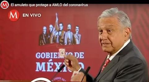 Mexican President Andrés Manuel López Obrador displays images of the Sacred Heart of Jesus at a March 18, 2020, news conference in Mexico City. (CNS screen grab/milenio.com)