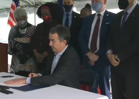 Virginia Gov. Ralph Northam signs legislation outside the Greensville Correctional Center in Jarratt March 24, 2021, making Virginia the 23rd state to abolish the death penalty. (CNS screen grab/Courtesy of Catholic Herald)
