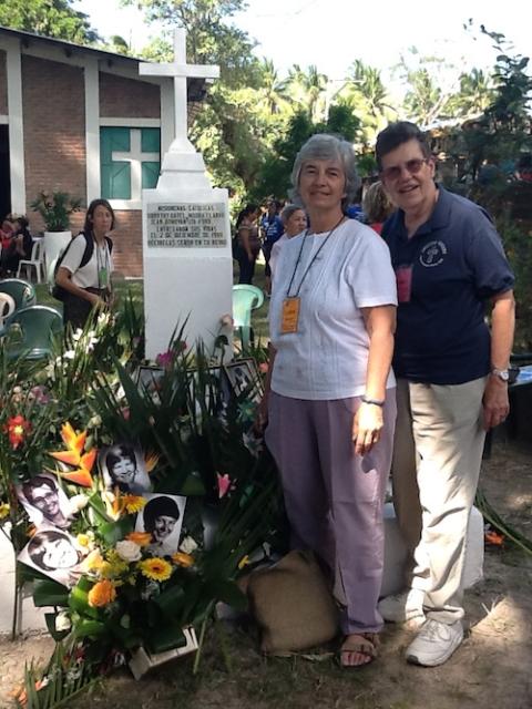 Ursuline Srs. Carol Reamers of Toledo, Ohio, and Janet M. Peterworth of Louisville, Kentucky, at the grave marker for the four murdered churchwomen in El Salvador in 2015 (Provided photo)