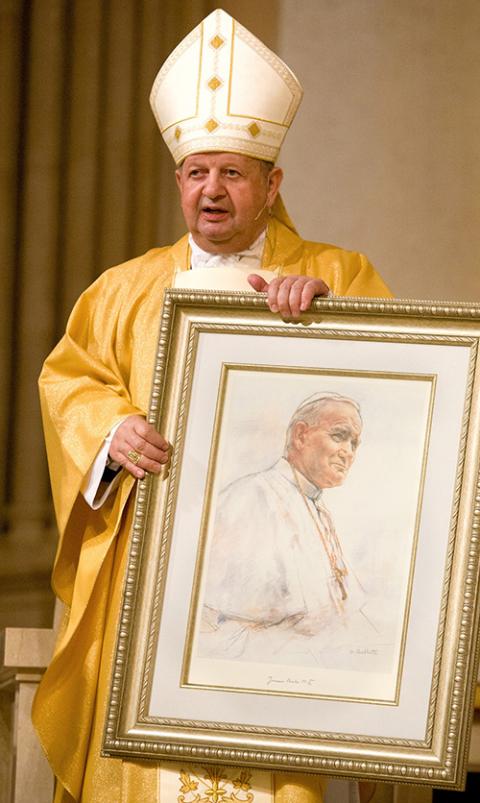 Polish Cardinal Stanislaw Dziwisz presents a framed portrait of Pope John Paul II to members of St. Patrick Parish in Miami Beach Feb. 3, 2005. (CNS/Tom Tracy) Polish Cardinal Stanislaw Dziwisz presents a framed portrait of Pope John Paul II to members of St. Patrick Parish in Miami Beach Feb. 3, 2005. (CNS/Tom Tracy)