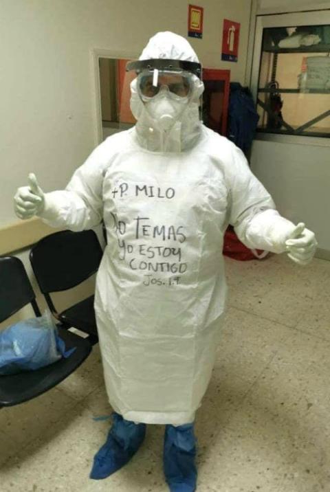 Fr. Emiliano Quezada dons personal protective equipment to work as a chaplain in COVID-19 wards in Reynosa, Mexico. He wrote a verse from Joshua 1:9, which reads, "Do not be afraid, I am with you." (Courtesy of Matamoros Diocese)