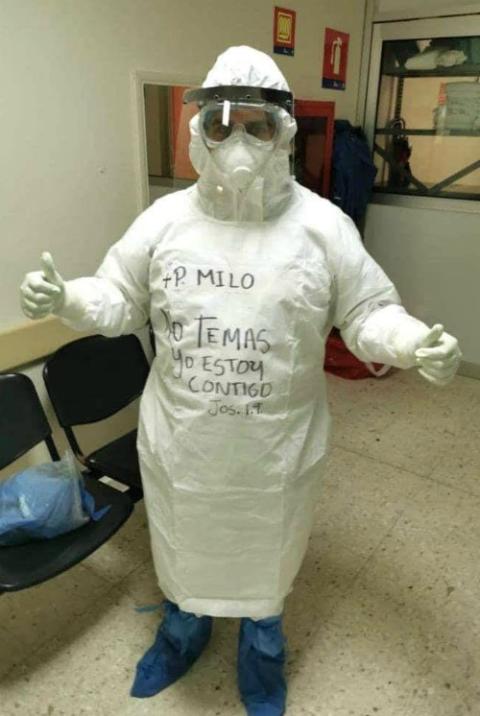 Fr. Emiliano Quezada dons personal protective equipment to work as a chaplain in COVID-19 wards in Reynosa, Mexico. He wrote a verse from Joshua 1:9, which reads, "Do not be afraid, I am with you." (Courtesy of Matamoros Diocese) Fr. Emiliano Quezada dons personal protective equipment to work as a chaplain in COVID-19 wards in Reynosa, Mexico. He wrote a verse from Joshua 1:9, which reads, "Do not be afraid, I am with you." (Courtesy of Matamoros Diocese)