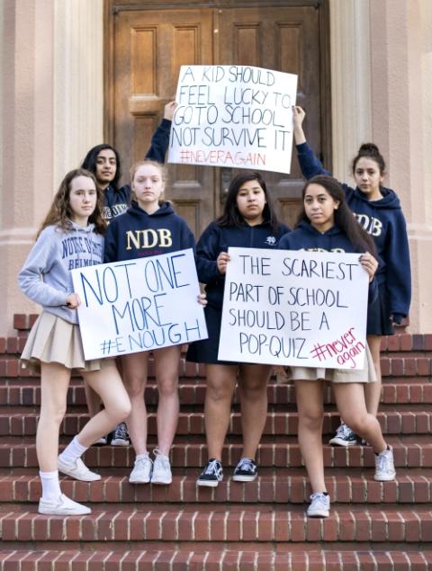 Students from Notre Dame High School in Belmont, California, hold posters calling for action on gun violence. (Courtesy of Notre Dame High School) Students from Notre Dame High School in Belmont, California, hold posters calling for action on gun violence. (Courtesy of Notre Dame High School)