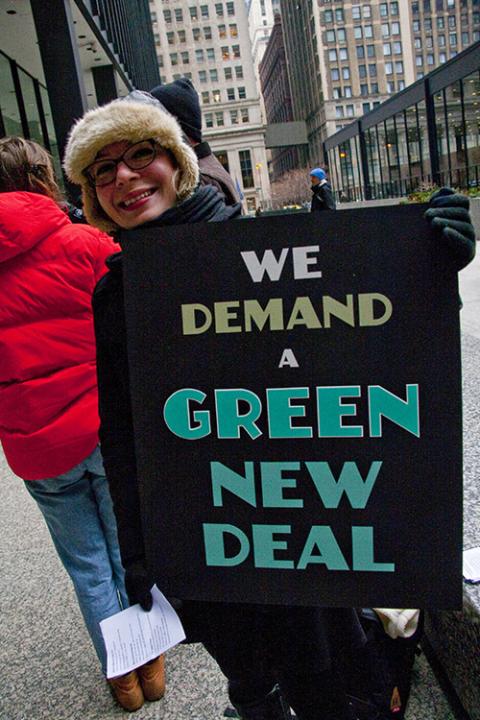 A demonstrator participates in a Sunrise Movement rally for a Green New Deal in Chicago Feb. 27, 2019. (Flickr/Charles Edward Miller)