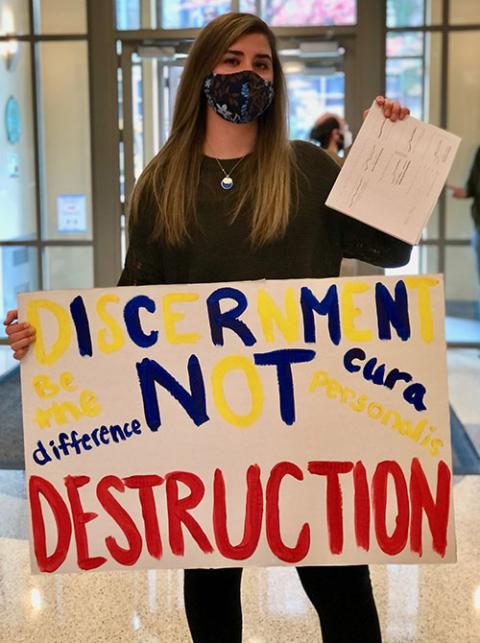 Brooke McArdle, a senior at Marquette University, is pictured during an Oct. 21 sit-in at the university’s administration building opposing deep budget cuts she says will harm the school’s mission and reputation. (Courtesy of Brooke McArdle)
